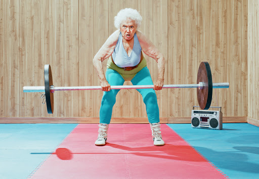 Older lady performing deadlift